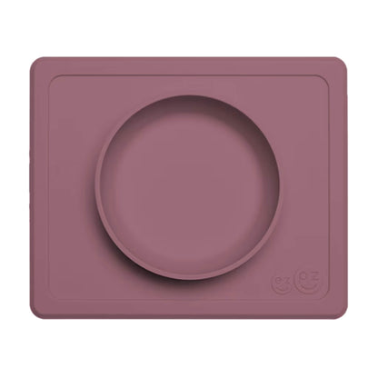 Mauve Mini Feeding Bowl shown from above, a silicone suction bowl built into a rectangular placemat to reduce spills during baby mealtimes.