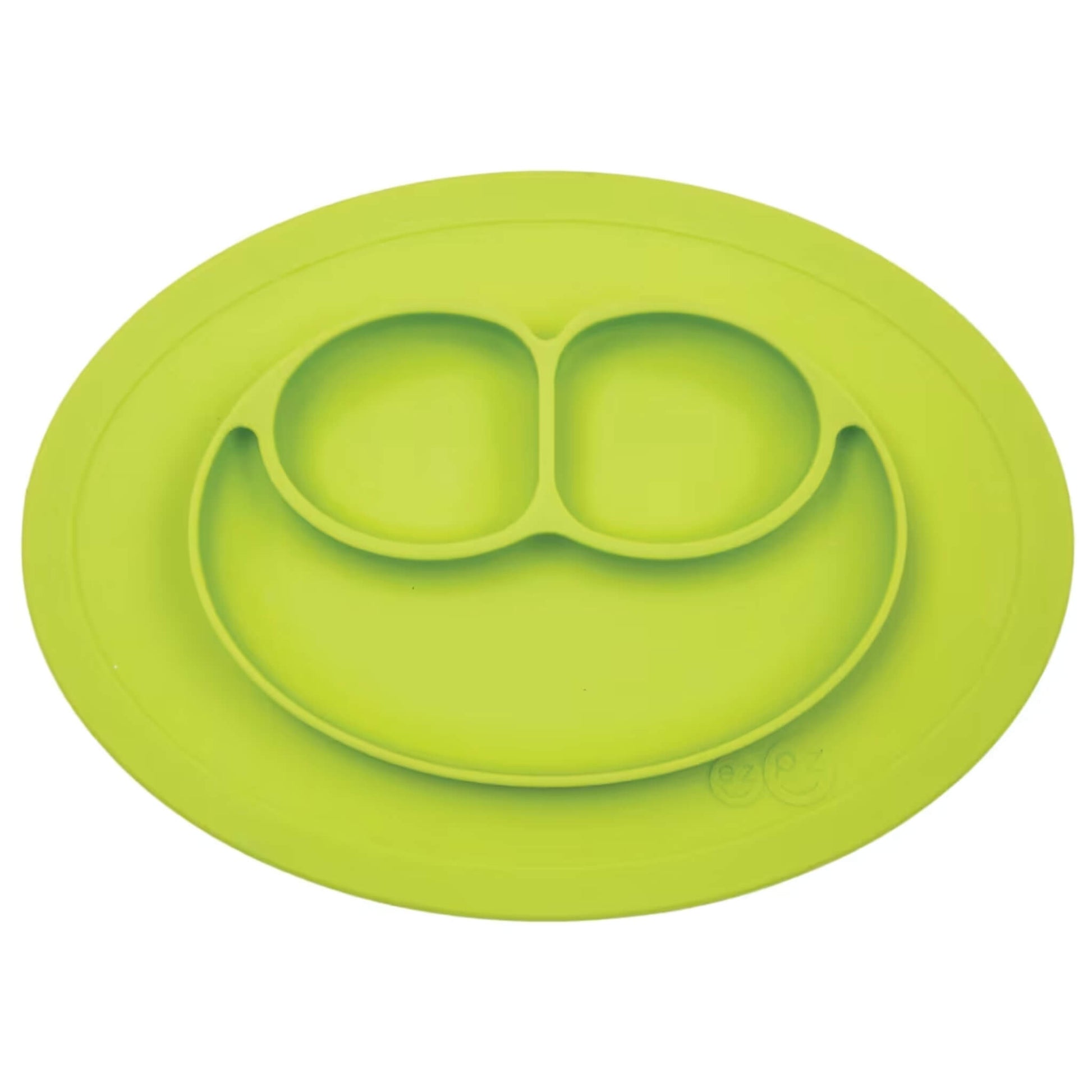 Ezpz Mini Mat in lime coloured silicone, an all-in-one suction placemat and baby plate with three divided sections arranged in a smile design.