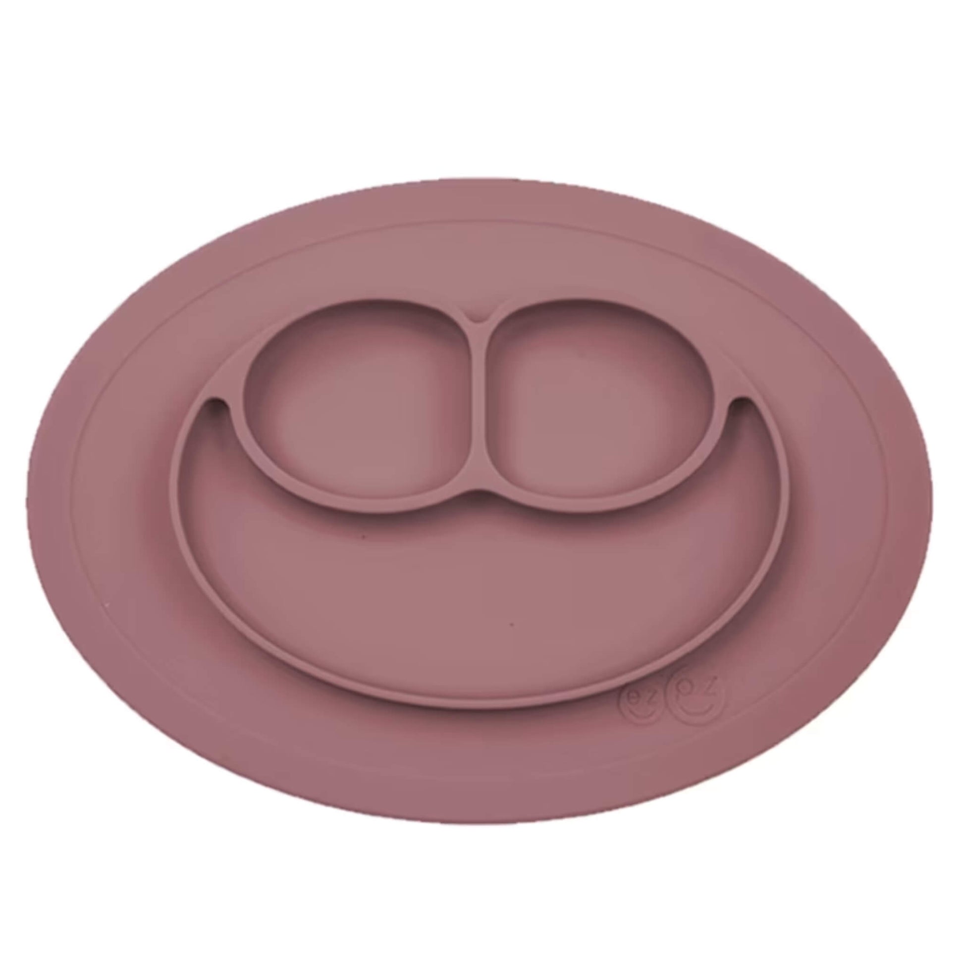 Ezpz Mini Mat in mauve silicone, a suction placemat and baby plate in one, featuring three divided sections in a smiley face layout.
