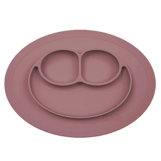 Ezpz Mini Mat in mauve silicone, a suction placemat and baby plate in one, featuring three divided sections in a smiley face layout.