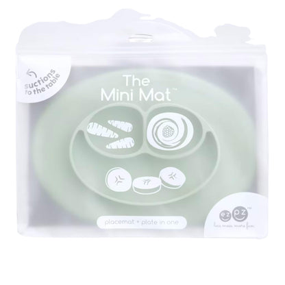 Clear zip storage bag with branding showing The Mini Mat in sage, labelled as a suction placemat and plate in one, with simple food illustrations on the packaging.