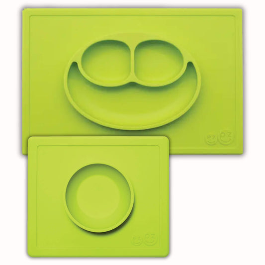 ezpz Happy Bundle in lime green with a divided suction plate and bowl, both placed on matching rectangular silicone placemats.