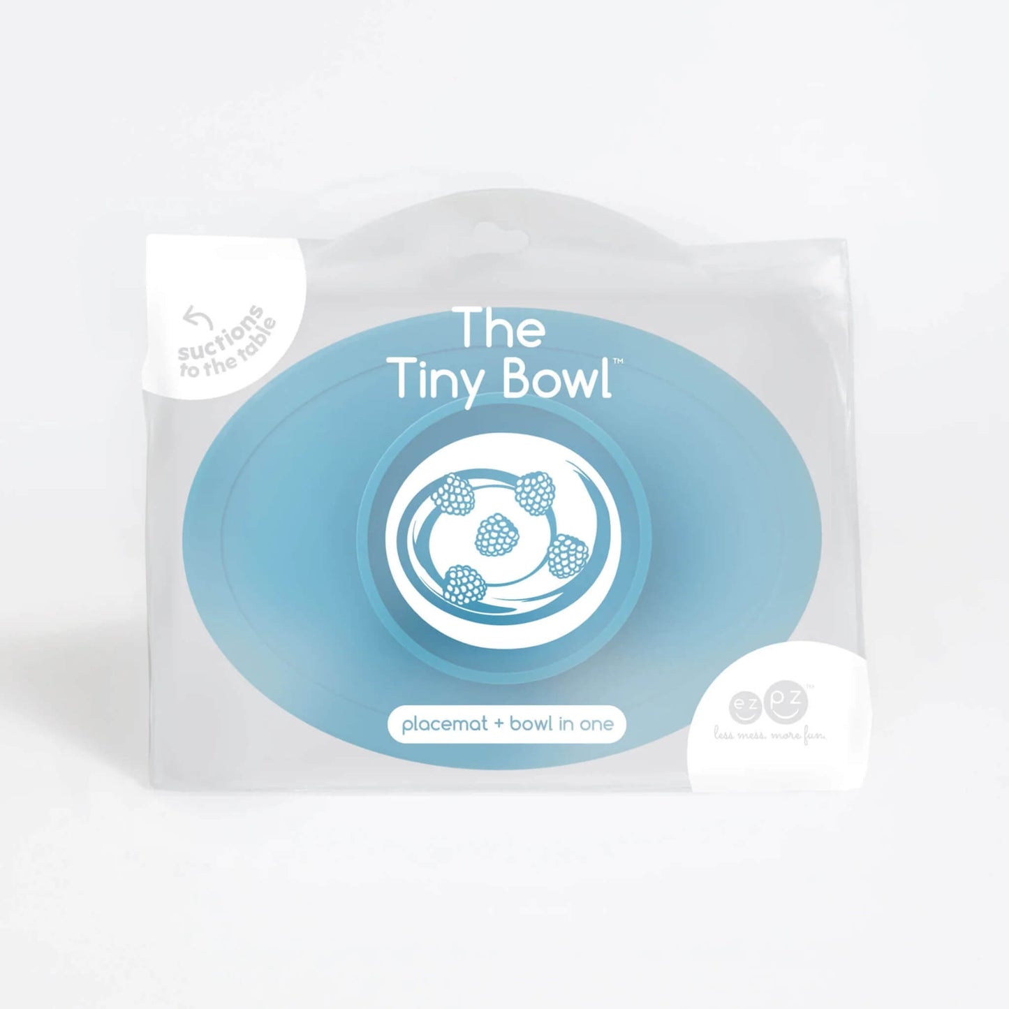 Product packaging showing the ezpz Tiny Bowl with an illustration of raspberries inside the bowl and text that reads placemat + bowl in one.