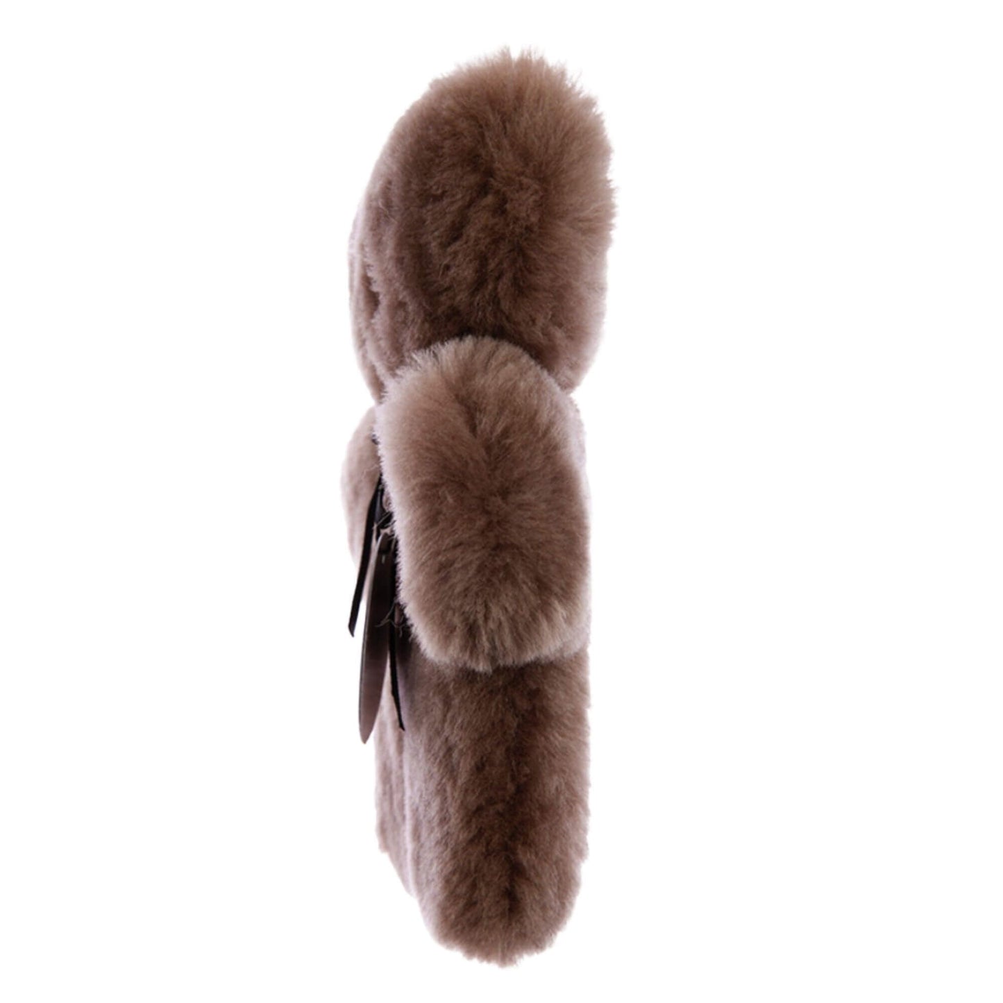 A side view of a flat sheepskin teddy comfort toy in chocolate brown, highlighting a slim, lightweight profile with dense plush fleece and softly rounded ears.