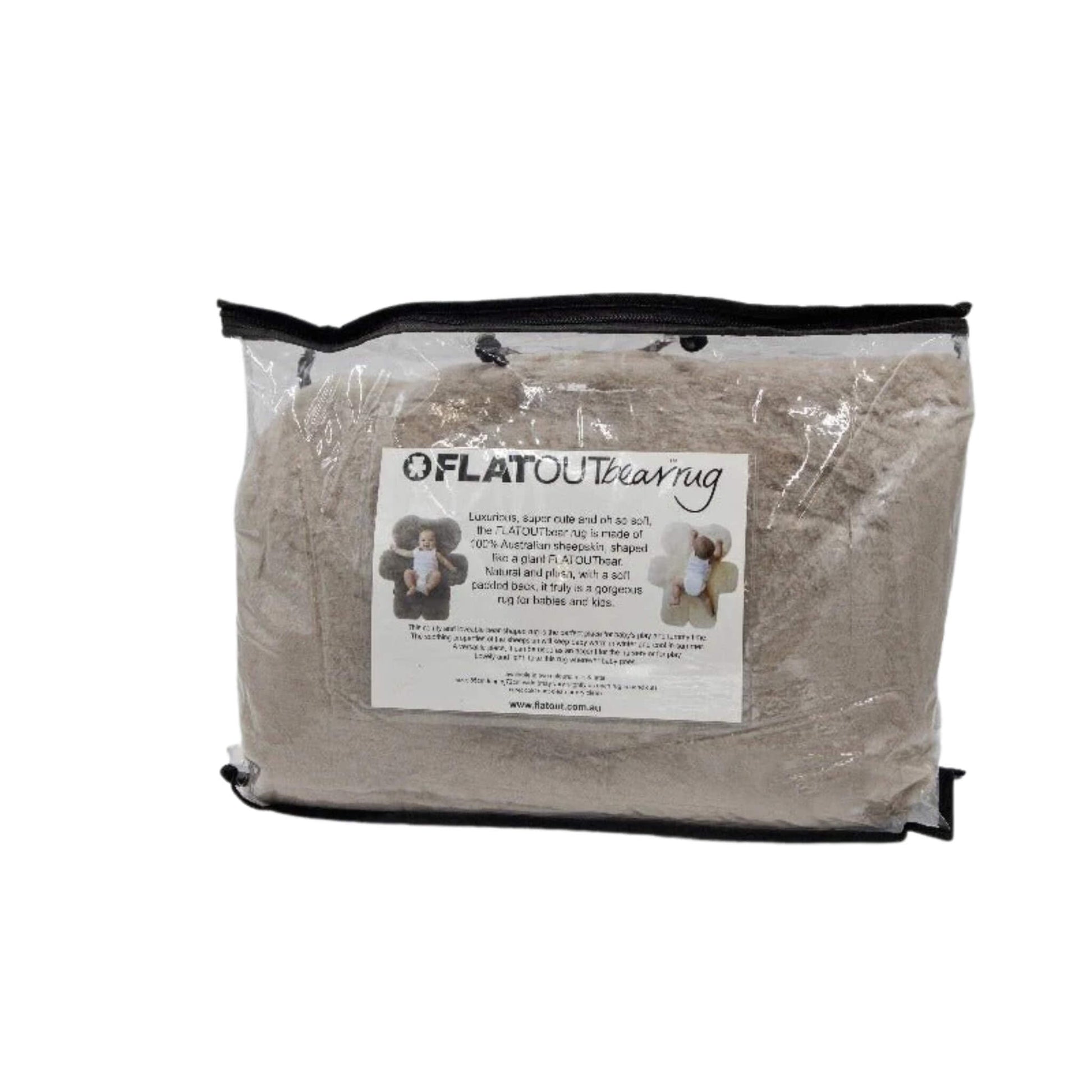 A bear-shaped sheepskin baby play rug folded inside a clear zip storage bag with product label visible on the front.