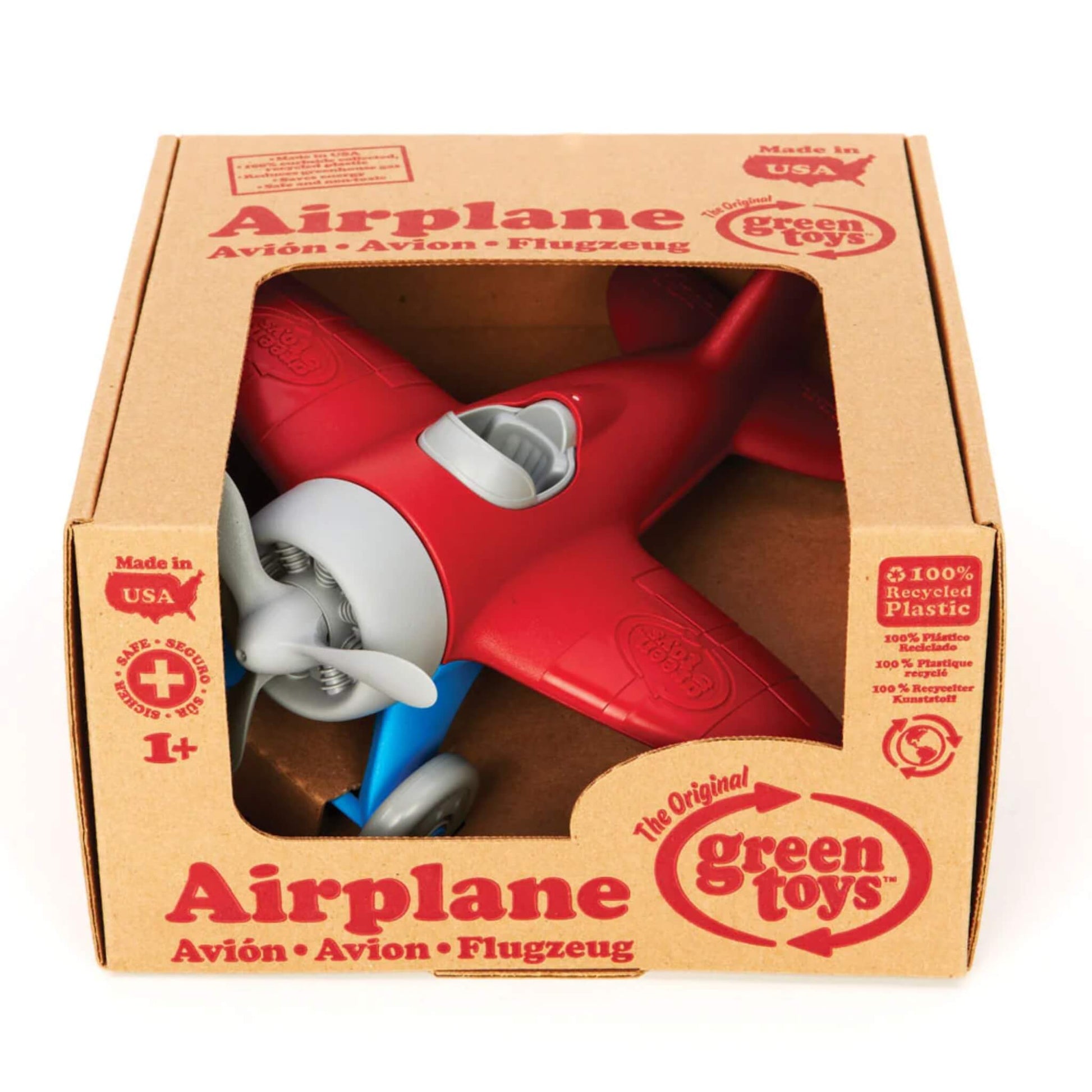 Red-winged toy airplane displayed inside its original Green Toys packaging with printed branding, age suitability and eco-friendly details.