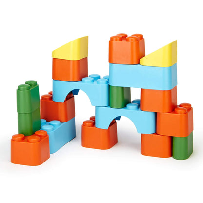 Colourful interlocking building blocks arranged into a playful structure using orange, blue, green, and yellow pieces.