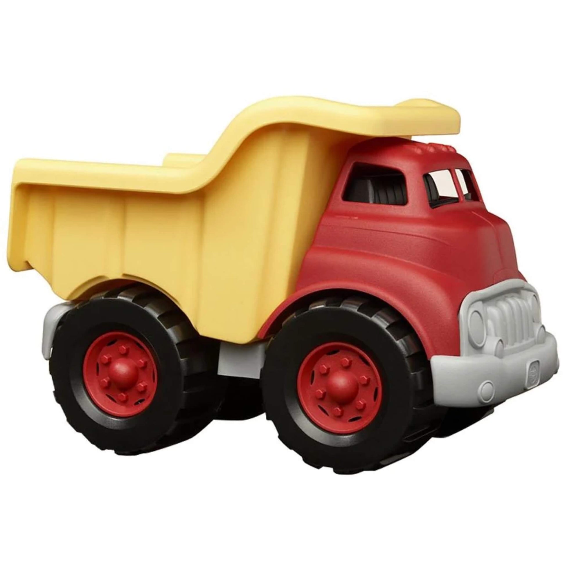 Green Toys Dump Truck in red and yellow with chunky black wheels and a grey bumper, shown in a side view with the dumper bed lowered.
