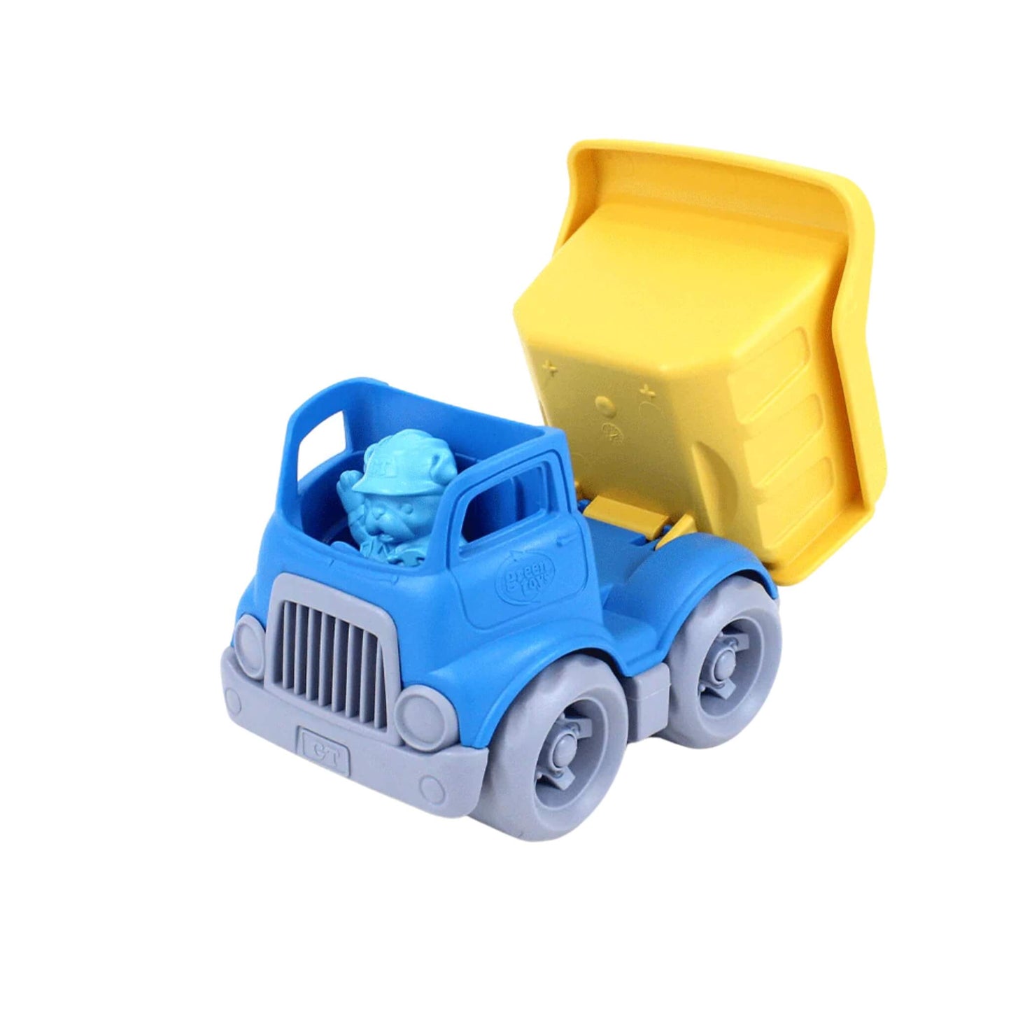 Side view of the Green Toys dumper truck with the yellow bed lifted to show its tilting function, and the bulldog driver figure in the cab.