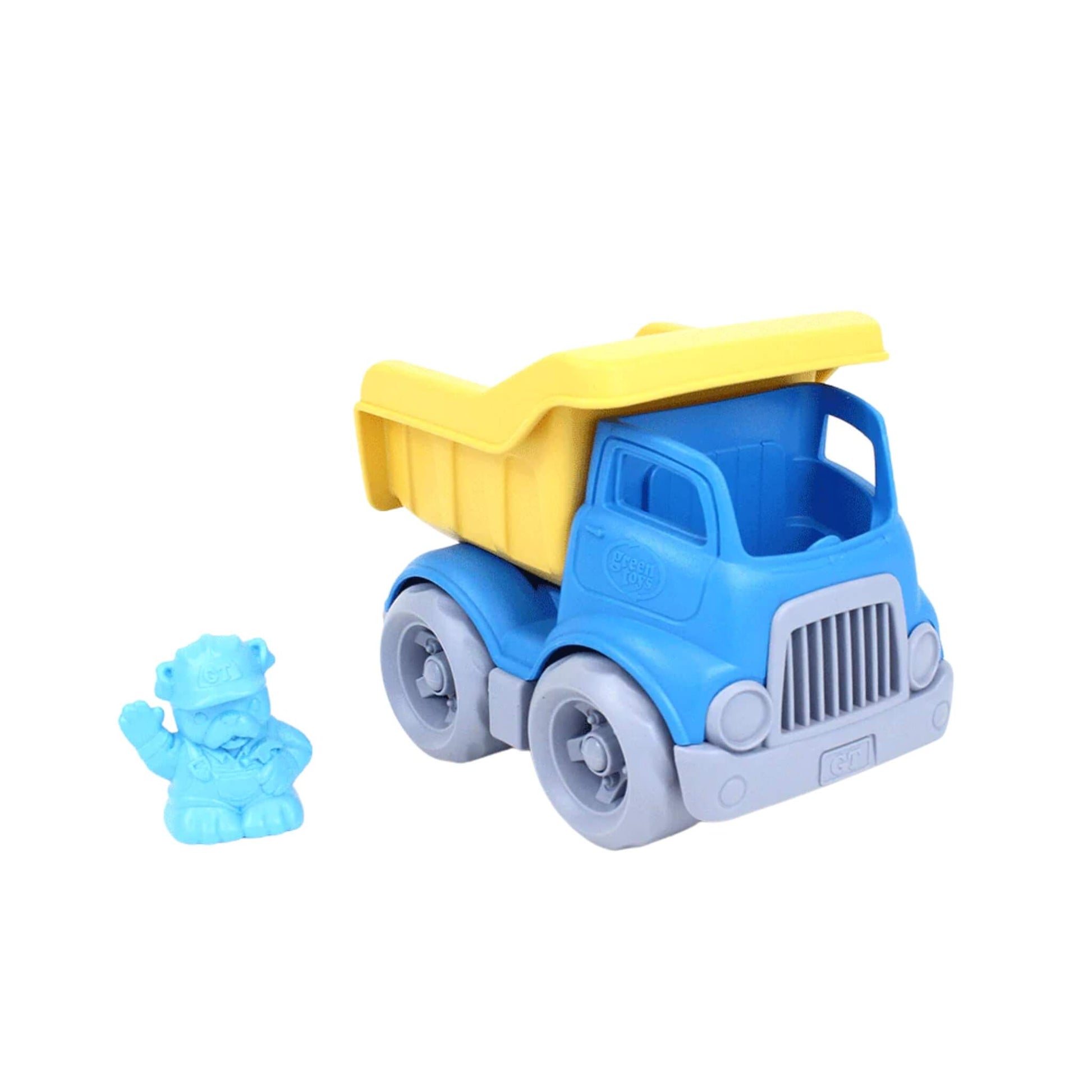 Green Toys dumper with bulldog driver figure placed beside it, showing removable character and empty cab space.