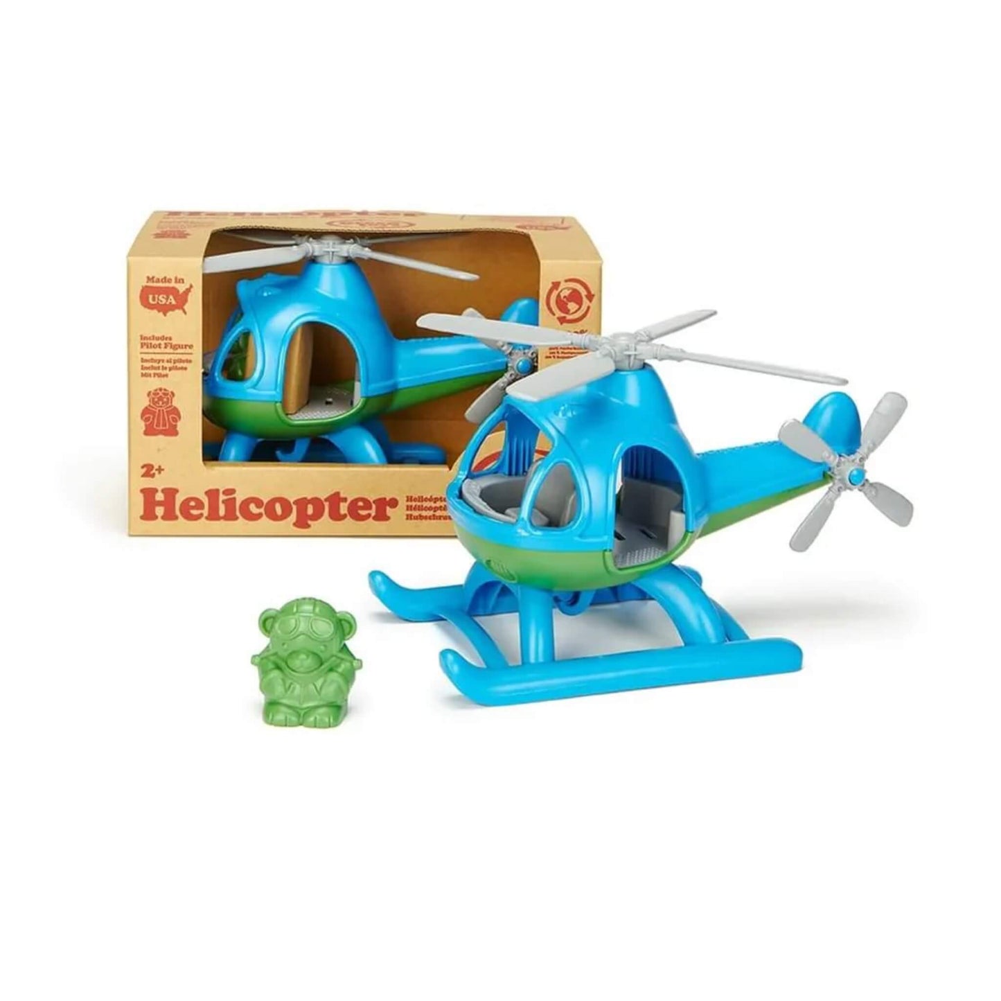 Toy helicopter and pilot figure displayed next to its recycled cardboard packaging, showing product presentation and scale.