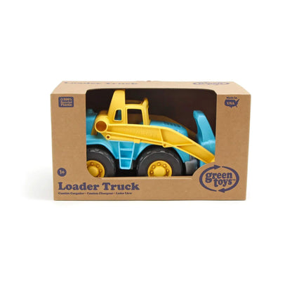 Loader truck displayed inside recycled cardboard packaging, with front window cutout and Green Toys branding clearly visible.