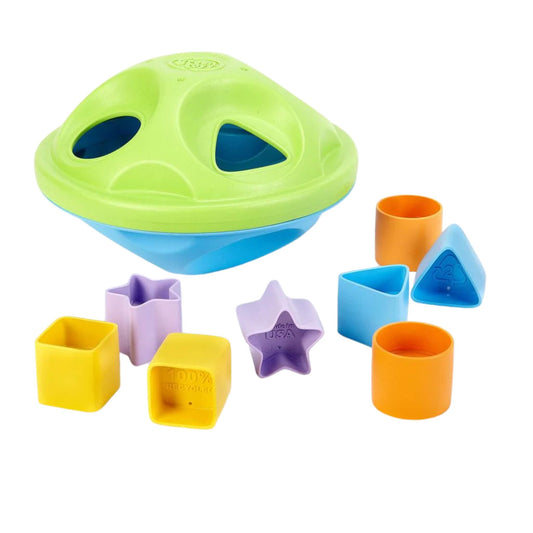 Green Toys My First Shape Sorter shown with colourful shapes arranged around the sorter lid, ready for matching and sorting.