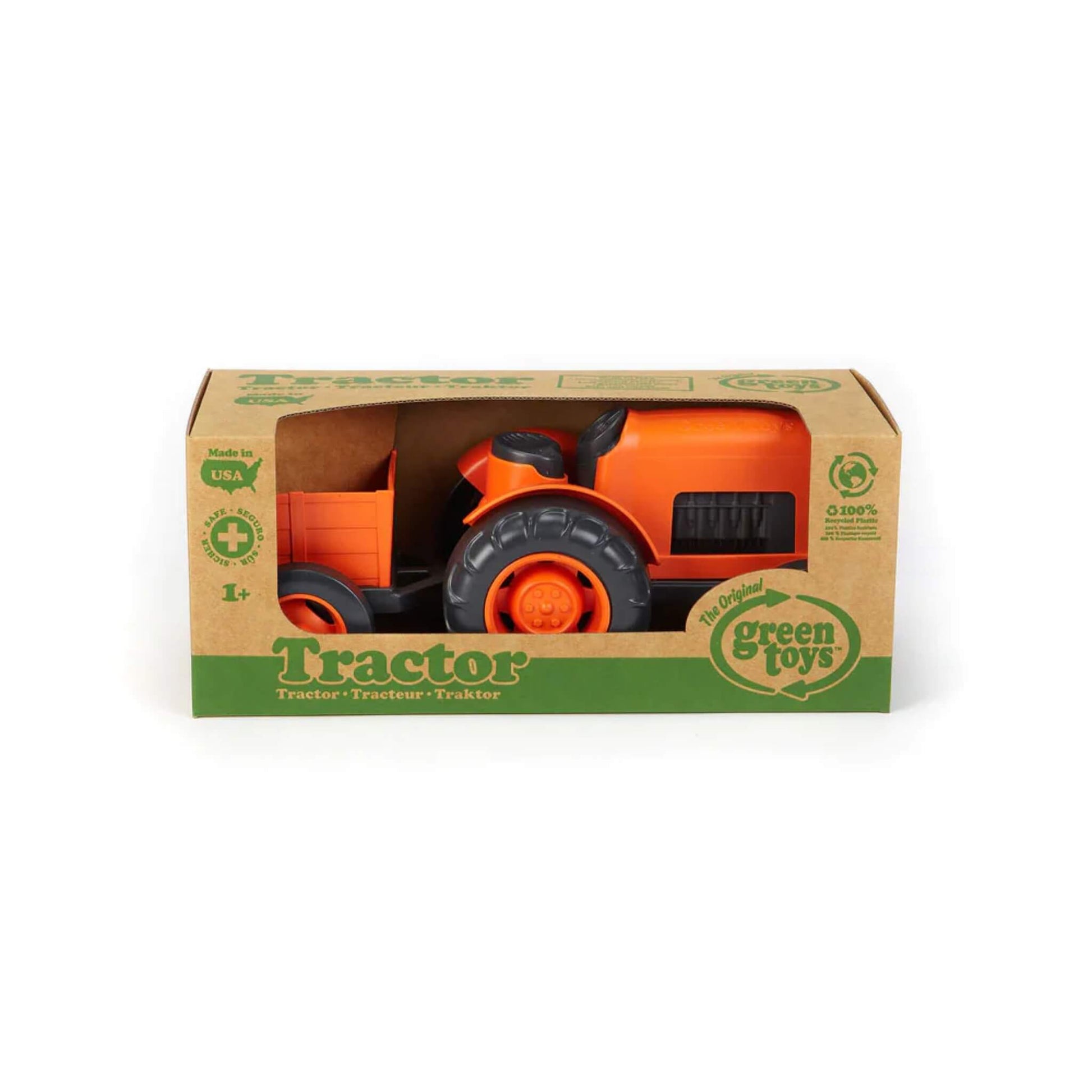 Green Toys orange Tractor displayed in its cardboard packaging with eco-friendly branding, suitable from age 1+.