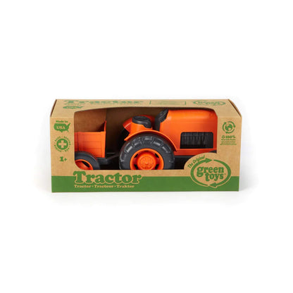 Green Toys orange Tractor displayed in its cardboard packaging with eco-friendly branding, suitable from age 1+.