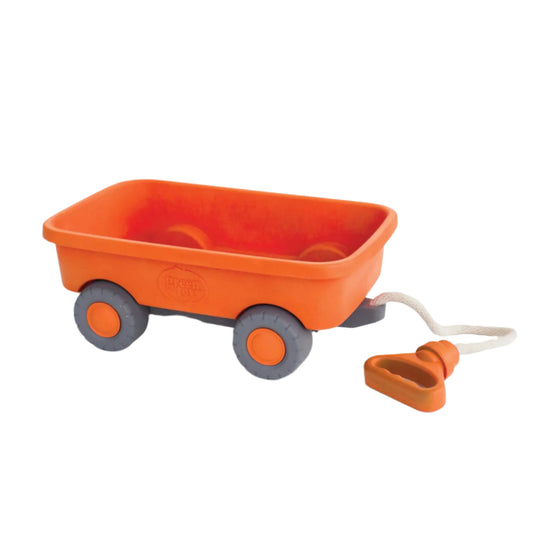 Green Toys Orange Wagon shown on a plain background. Features a bright orange body, grey wheels and a white cotton rope handle with a triangular grip.