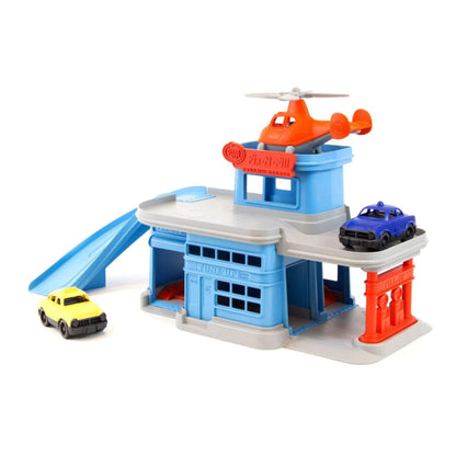 Green Toys Parking Garage shown assembled with mini helicopter on the helipad and two mini cars on different levels, highlighting the full playset.