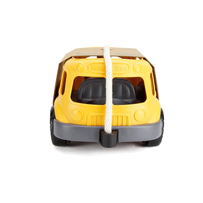Front view of the Green Toys bus wagon showing seat detail through the windshield and the cotton rope anchored centrally.