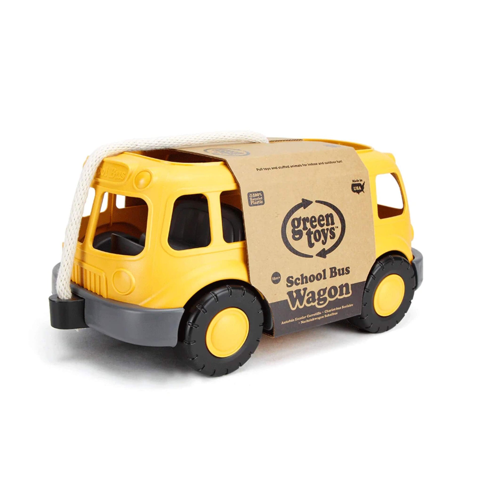 Rear angled view of the wagon with retail packaging in place, showing the Green Toys logo and product label wrapped across the top.