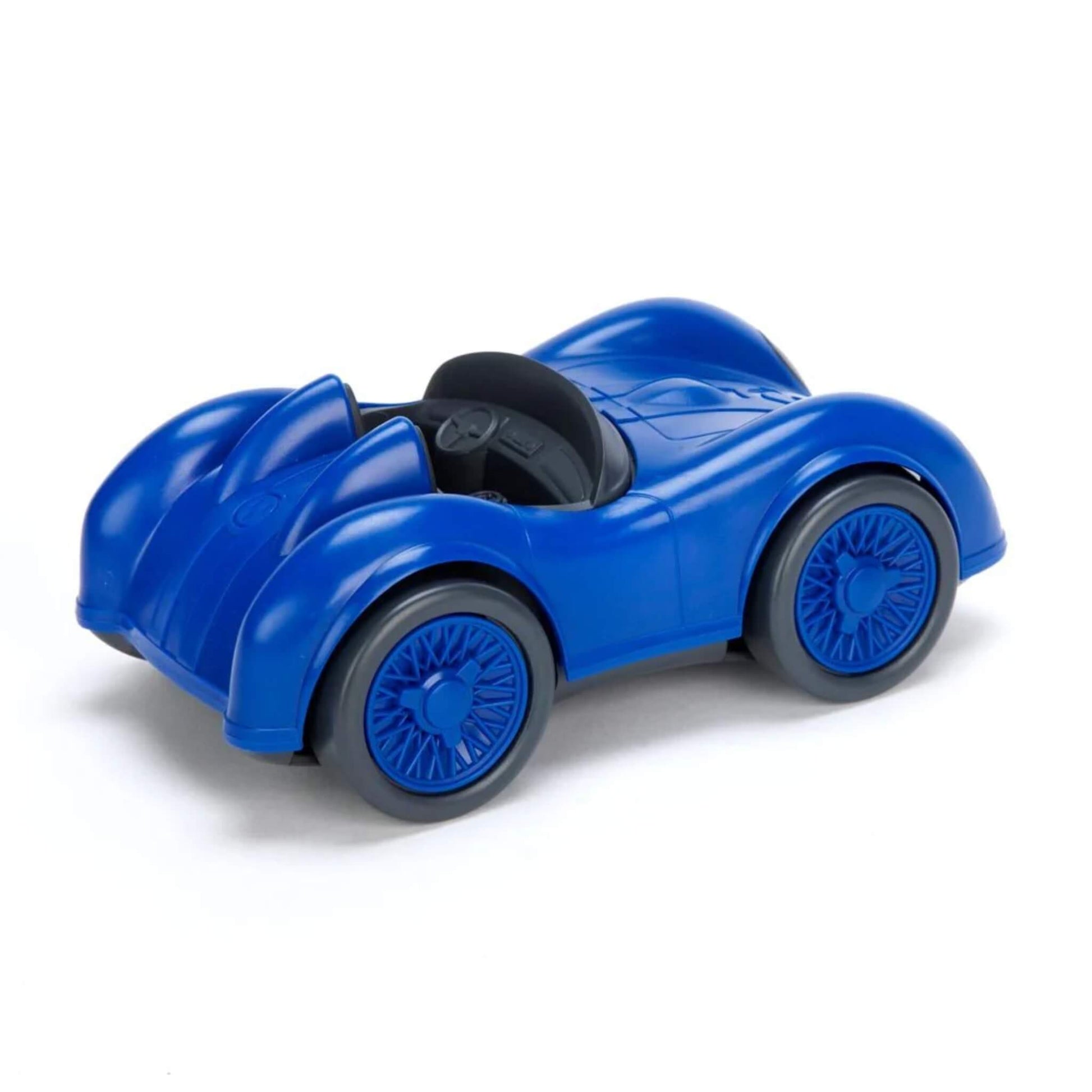 Rear angled view of the blue racing car showing sculpted rear curves, twin seats and a black steering wheel.