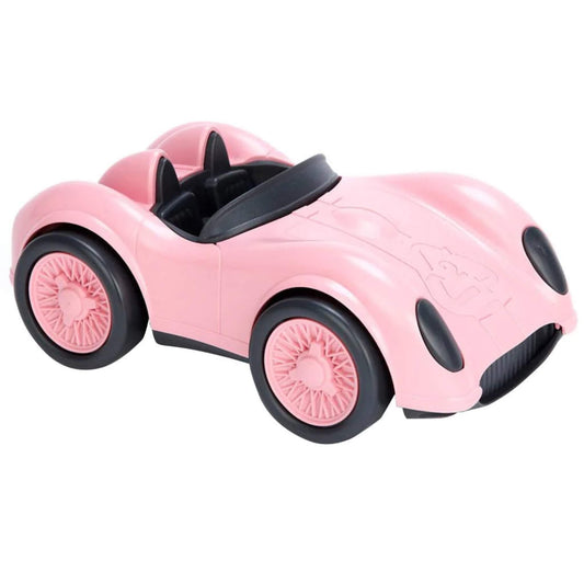 Pink Green Toys Racing Car with black wheels and open-top design, shown in close-up on a white background.