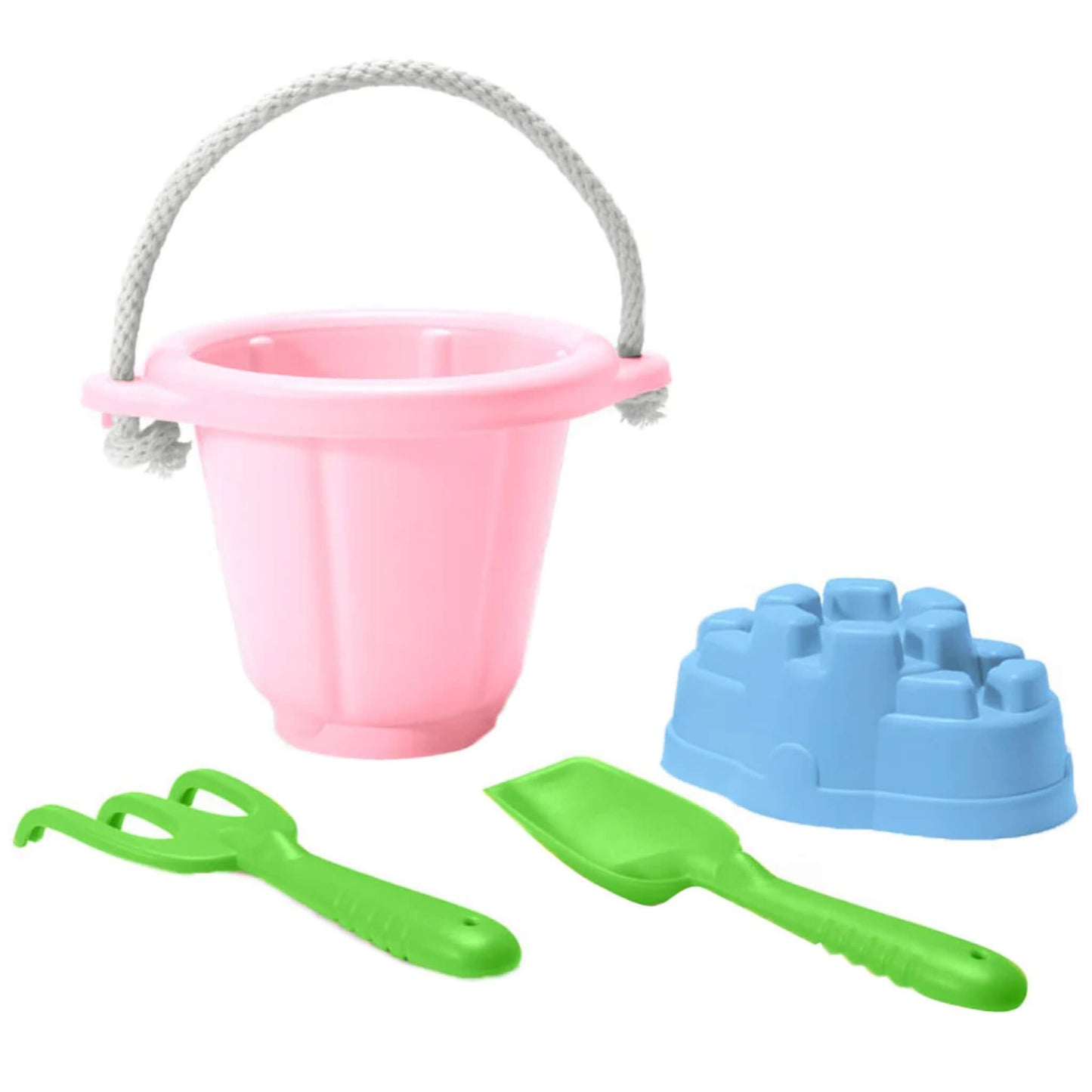 Green Toys Sand Play Set in pink featuring a pink bucket with white rope handle, green spade and rake, and a blue sandcastle mould, all displayed on a white background.