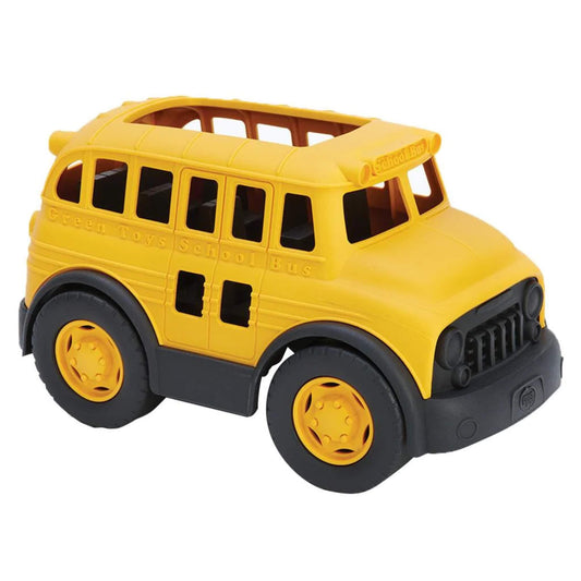 Green Toys School Bus in yellow with black wheels, shown angled from the front to display its open windows, rounded roof and sturdy recycled plastic design.