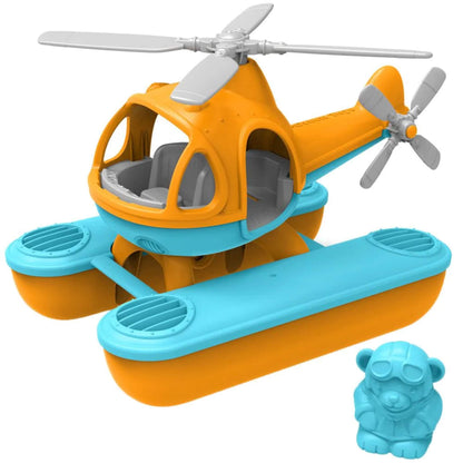 Green Toys Seacopter in orange and blue with grey rotors and pontoons, shown with matching blue bear pilot figure beside the cockpit.