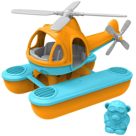 Green Toys Seacopter in orange and blue with grey rotors and pontoons, shown with matching blue bear pilot figure beside the cockpit.