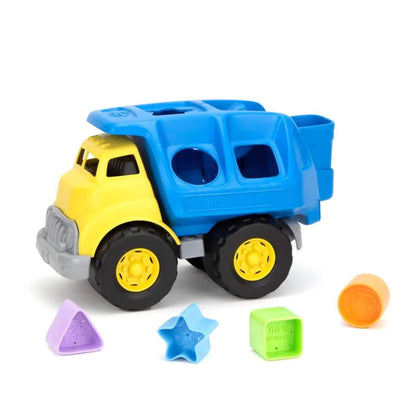 Front side view of the shape sorter truck with all four colourful shapes—star, triangle, square, and circle—arranged clearly in front.