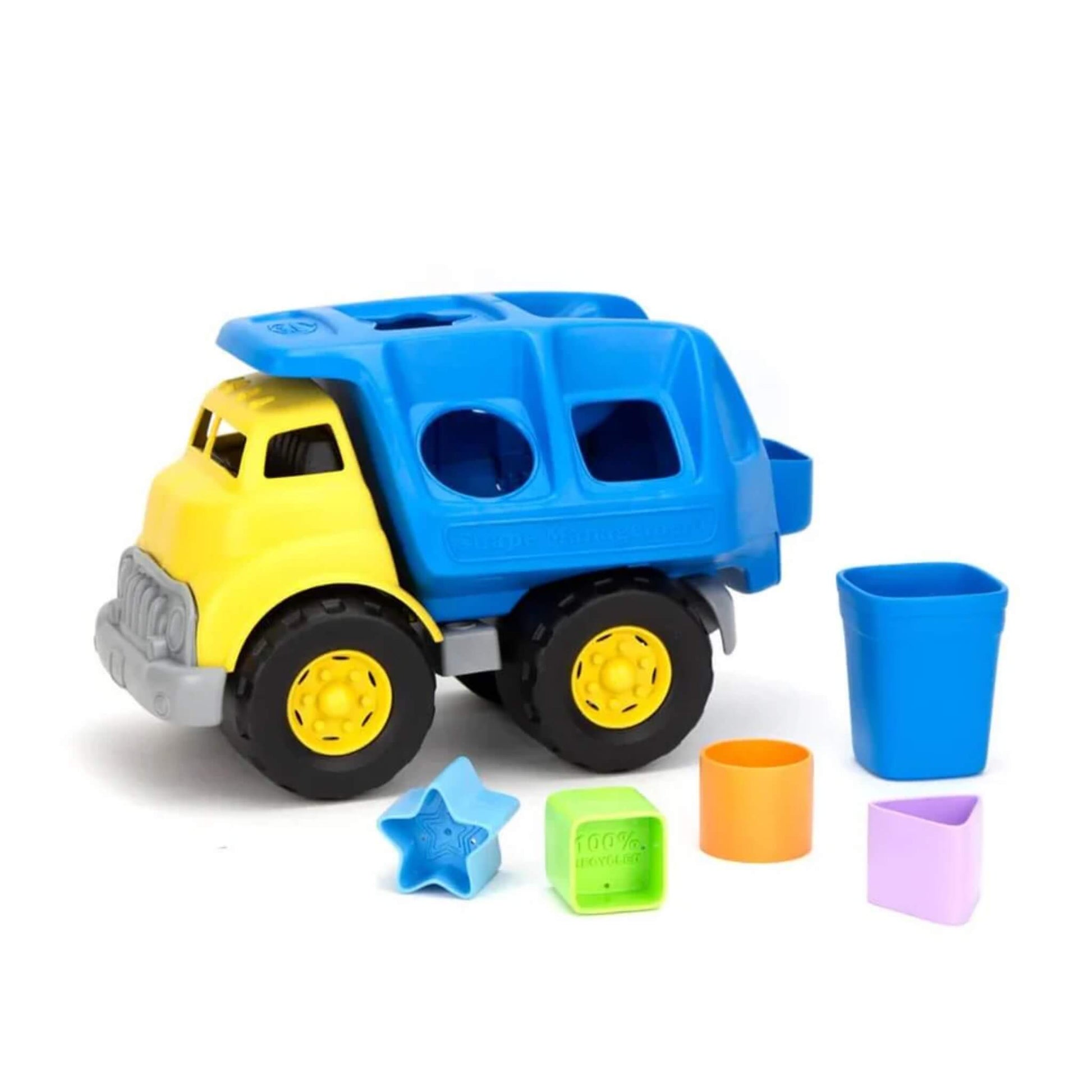 Truck with all five sorting shapes displayed at the front and a blue recycling bin placed upright next to the truck’s rear.
