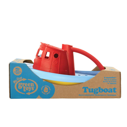 Green Toys Tugboat with red top packaged in recycled cardboard, labelled for ages 6 months+ and made from 100% recycled plastic.