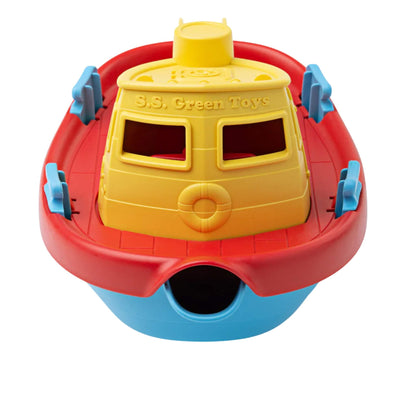 Front view of the tugboat, highlighting the wide spout for pouring and the embossed ‘S.S. Green Toys’ logo above the windows.