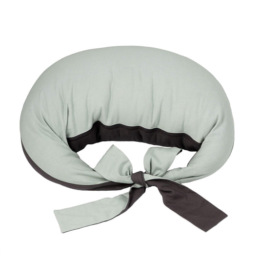 Hippychick Feeding Pillow in Charcoal and Sage Green shown in a crescent shape with wide fabric ties, designed to support breastfeeding and bottle feeding.