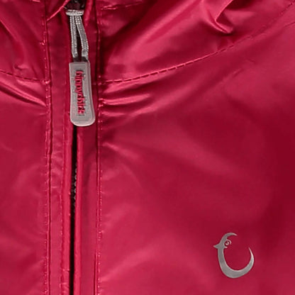 Close-up view of the Packasuit zip and reflective brand logo detail on the chest in the Pink Peacock colour.
