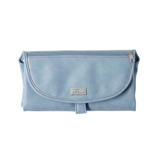 Isoki Change Mat Clutch in light blue, folded neatly with zip pocket and metal brand plate visible on the front.