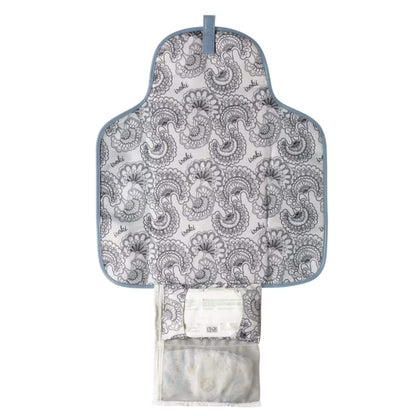 Open change mat clutch showing the patterned padded mat, mesh pocket for nappies and wipes, and storage section for essentials.