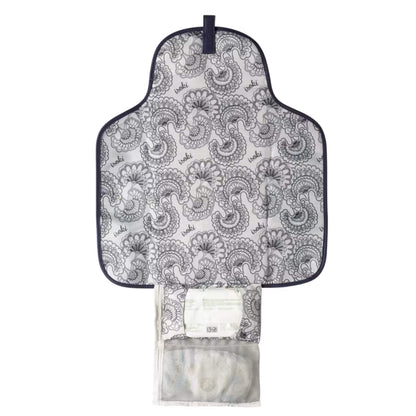 Open change mat clutch showing the patterned padded mat, mesh pocket for nappies and wipes, and storage section for essentials.