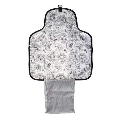 Open change mat clutch showing the patterned padded mat, mesh pocket for nappies and wipes, and storage section for essentials.