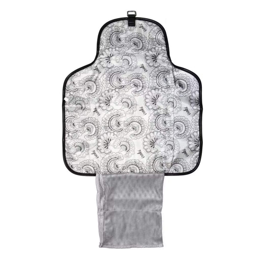 Open change mat clutch showing the patterned padded mat, mesh pocket for nappies and wipes, and storage section for essentials.