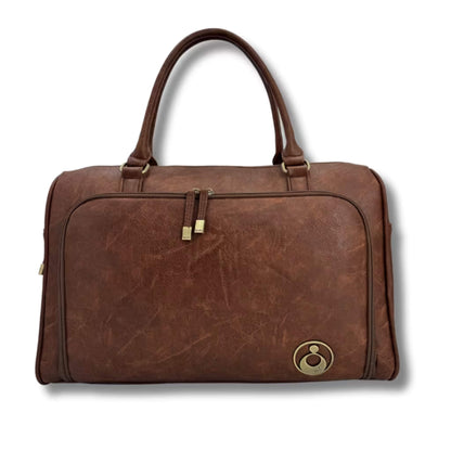 Isoki Double Zip Satchel Changing Bag in Redwood Chestnut, featuring structured design, gold hardware, and dual top handles.