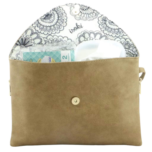 Open beige change mat clutch lined with floral printed fabric, showing nappies, wipes, and baby essentials neatly packed inside.