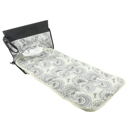 Angled view of a baby change mat clutch in Onyx black, displaying the extended mat and detailed patterned interior.