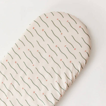Top-down view of a fitted sheet laid flat, showing the full Night Sky pattern with scattered stars and flowing green lines.