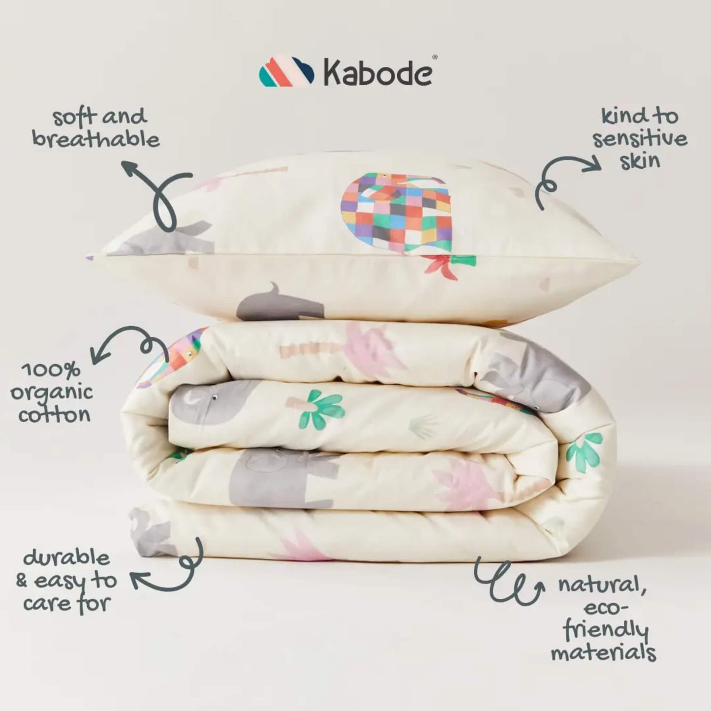 A folded duvet and pillowcase stack on a neutral background, with illustrated arrows highlighting breathable fabric, organic cotton material, and easy care qualities.