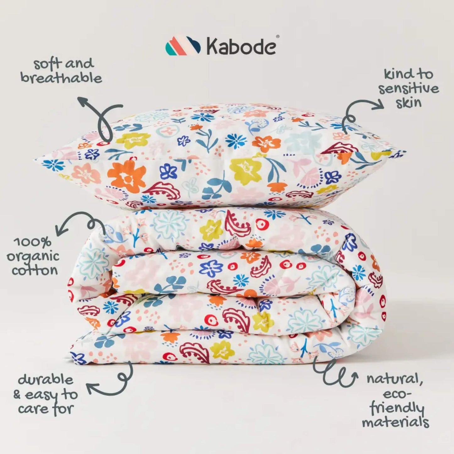 Stacked duvet and pillow stacked neatly to show the floral pattern and colour variation across the fabric surface.