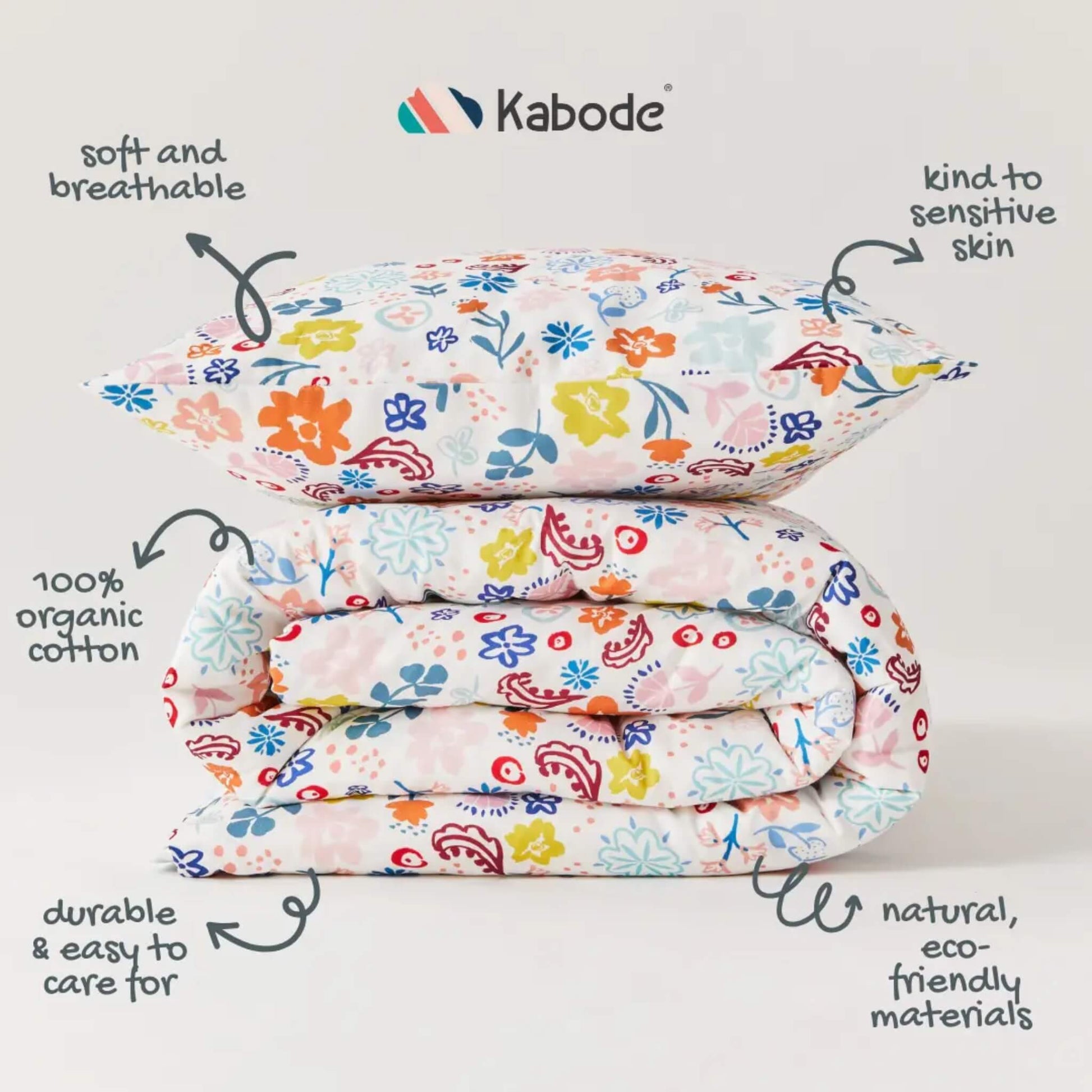 Stacked duvet and pillow stacked neatly to show the floral pattern and colour variation across the fabric surface.