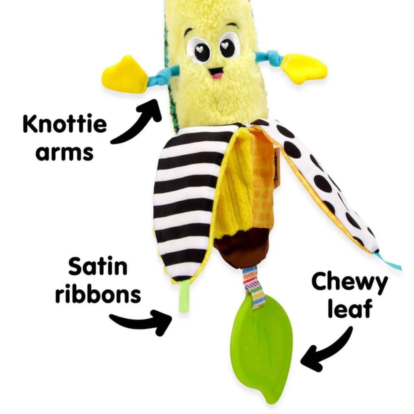 Yellow baby toy showing knotty fabric arms, smooth satin ribbons, and a flexible green leaf teether hanging beneath.