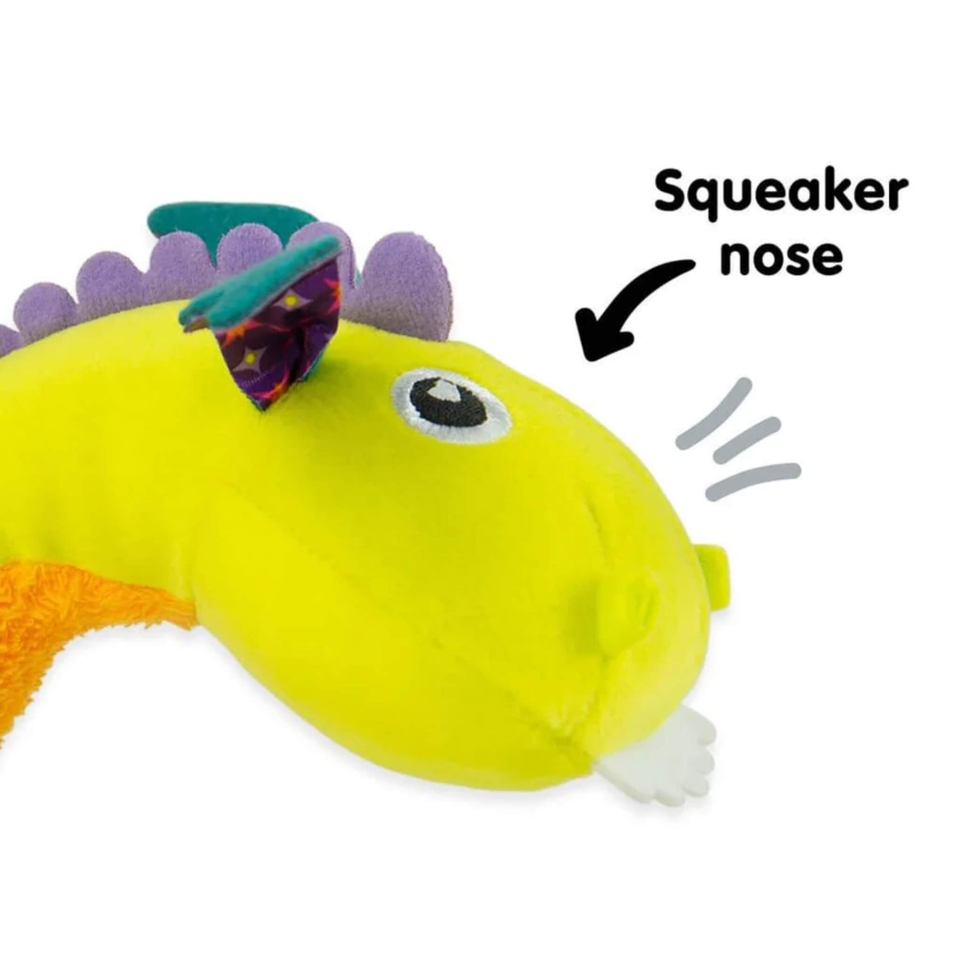 Soft, plush dragon toy with bright yellow squeaker nose highlighted for sensory play.