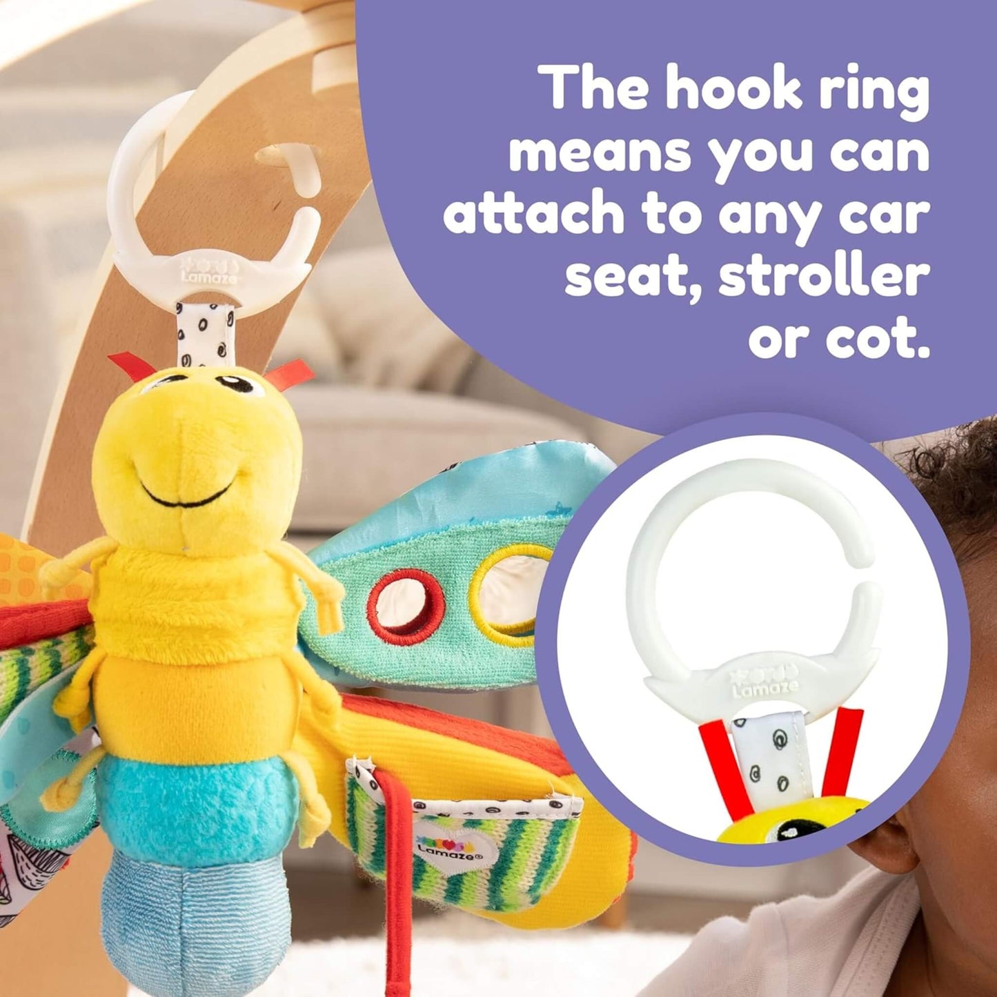 Firefly toy attached to a wooden baby gym using a white plastic hook clip.
